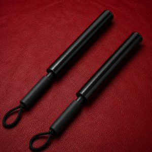Two Impact Core™ Thumpers displayed on a premium red leather background.