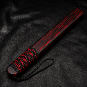 Black & Red Wood Thumper with a black and red paracord-wrapped handle displayed on a black leather background.