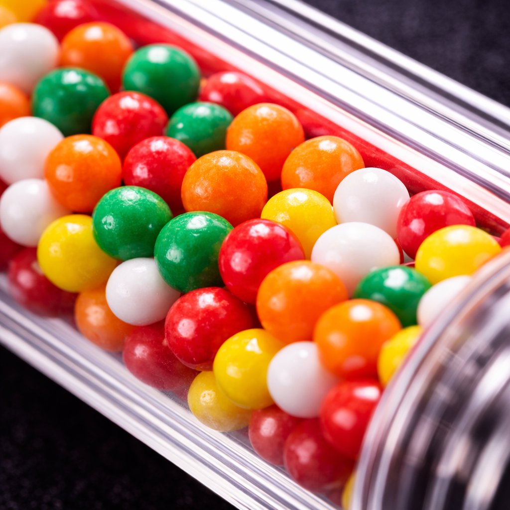 Extreme close up of lexan candy performance cane transparent shaft showing colorful candy core
