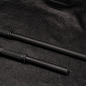 Short and Long Rubber Hose Thumpers with rubber handles displayed on a black leather background.